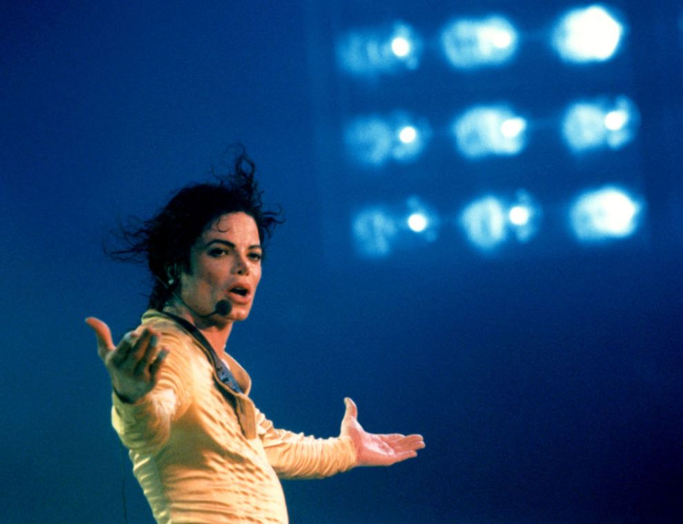 BANDAR SERI BEGAWAN, BRUNEI - JULY, 1996: American singer, songwriter, and dancer Michael Jackson (1958-2009) performs on stage during a concert for the 50th birthday of Hassanal Bolkiah, the Sultan of Brunei circa July, 1996 at the Jerudong Park Amphitheatre in Bandar Seri Begawan, Brunei.