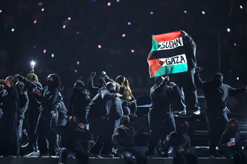 Super Bowl Crew Member Tackled After Waving Palestine Flag During Halftime Show